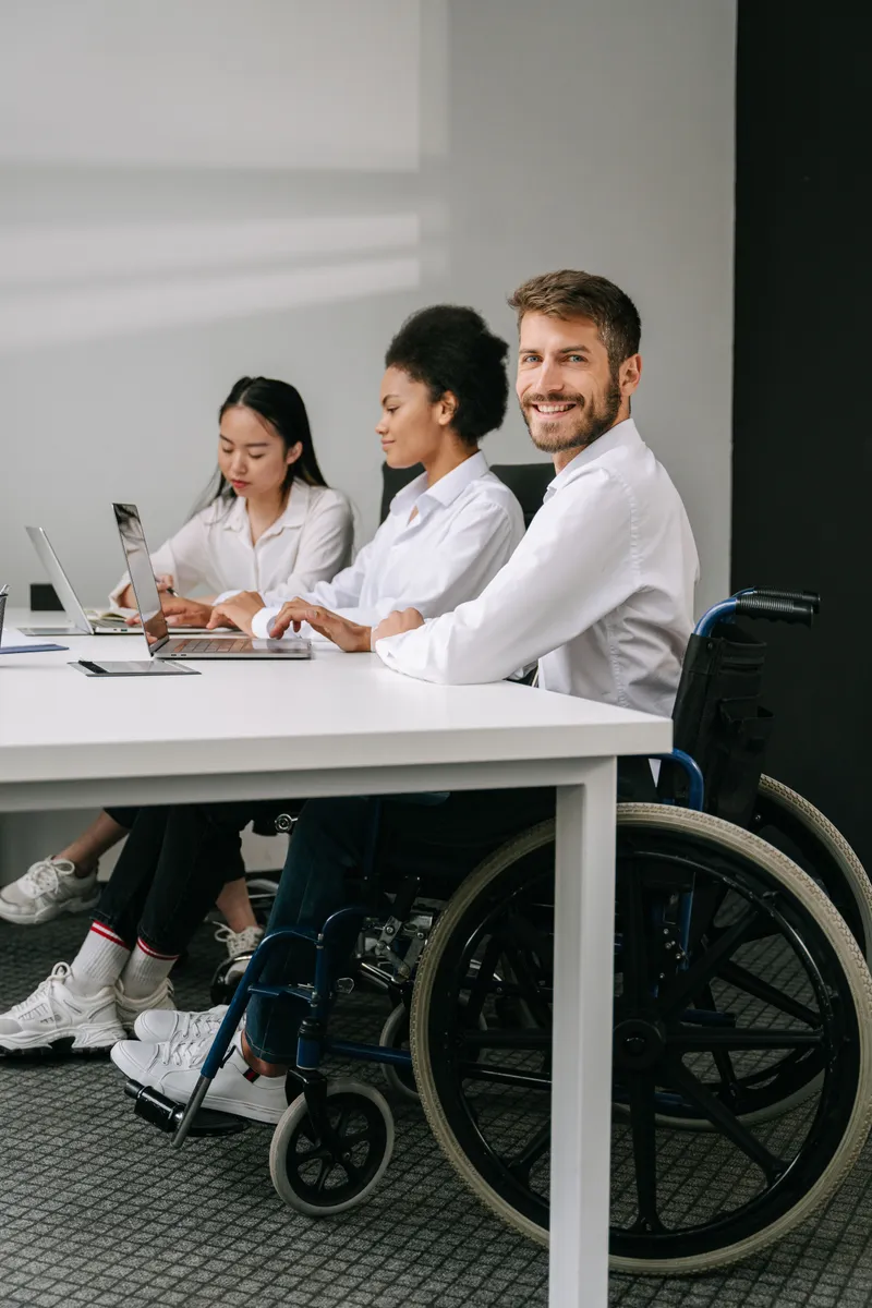 Support workers engaging with participants in a warm, collaborative setting